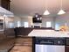 Open kitchen with stainless appliances, granite countertops, and an adjoining living area at 1243 Polk Xing, Mcdonough, GA 30252