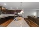 Modern kitchen featuring stainless steel appliances, dark cabinetry and granite countertops at 1243 Polk Xing, Mcdonough, GA 30252