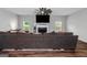 Spacious living room features a fireplace, large windows and ample seating on a comfortable couch at 1243 Polk Xing, Mcdonough, GA 30252