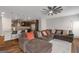Open-concept living space featuring a modern kitchen with bar seating and a comfortable couch at 1243 Polk Xing, Mcdonough, GA 30252