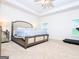 Bright primary bedroom featuring neutral walls, carpet, a ceiling fan, and a window at 1243 Polk Xing, Mcdonough, GA 30252