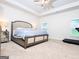 Bright primary bedroom featuring neutral walls, carpet, a ceiling fan, and a window at 1243 Polk Xing, Mcdonough, GA 30252