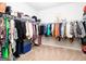 Large walk-in closet with ample hanging space for clothes and accessories at 1243 Polk Xing, Mcdonough, GA 30252