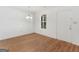 Cozy dining area with hardwood floors, white walls, and a view of the front yard at 150 Glynn Addy Dr, Stockbridge, GA 30281