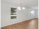 Bright dining area with hardwood floors and a view of the front yard from the window at 150 Glynn Addy Dr, Stockbridge, GA 30281