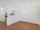 Open dining area featuring hardwood floors, a chandelier, and connection to the kitchen at 150 Glynn Addy Dr, Stockbridge, GA 30281
