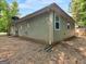 Exterior view of the home with green siding at 150 Glynn Addy Dr, Stockbridge, GA 30281