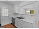 Clean kitchen featuring stainless steel sink and white cabinetry at 150 Glynn Addy Dr, Stockbridge, GA 30281