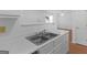 Bright kitchen with stainless steel sink and pass-through to living area at 150 Glynn Addy Dr, Stockbridge, GA 30281