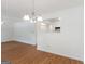 Spacious living room with hardwood floors and a view of the kitchen through an open wall at 150 Glynn Addy Dr, Stockbridge, GA 30281