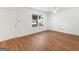 Bright living room with hardwood floors and a large window providing natural light at 150 Glynn Addy Dr, Stockbridge, GA 30281