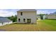 A cozy backyard featuring a sliding glass door and a small seating area, perfect for outdoor relaxation at 340 Indian Lake Trl, Villa Rica, GA 30180