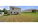 Large backyard with green grass and a view of the rear of the home at 340 Indian Lake Trl, Villa Rica, GA 30180