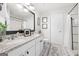 Bright bathroom featuring granite countertops, a double vanity, and tile floors at 340 Indian Lake Trl, Villa Rica, GA 30180