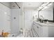 Bright bathroom featuring granite countertops, a double vanity, and a sleek shower at 340 Indian Lake Trl, Villa Rica, GA 30180