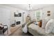 Bright bedroom with a fireplace, television, and cozy textiles for comfort at 340 Indian Lake Trl, Villa Rica, GA 30180