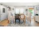 Dining area featuring bright natural light, hardwood floors, and a seamless flow into other living spaces at 340 Indian Lake Trl, Villa Rica, GA 30180