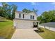 Beautiful two-story home featuring a two-car garage, covered porch, and a welcoming entrance at 340 Indian Lake Trl, Villa Rica, GA 30180