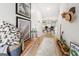 Bright hallway featuring stylish decor, wood floors, and a glimpse into the inviting living spaces at 340 Indian Lake Trl, Villa Rica, GA 30180