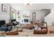 Inviting living room with a decorative fireplace, comfortable seating, and warm, natural lighting at 340 Indian Lake Trl, Villa Rica, GA 30180