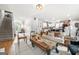 Open-concept living room with modern furnishings, seamlessly connected to the kitchen and dining area at 340 Indian Lake Trl, Villa Rica, GA 30180