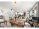 Spacious living room bathed in natural light, showcasing a comfortable seating arrangement and an open layout at 340 Indian Lake Trl, Villa Rica, GA 30180