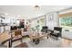 Bright and airy living room featuring a mix of modern and rustic decor, open to the kitchen area at 340 Indian Lake Trl, Villa Rica, GA 30180