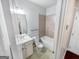 A bathroom features a shower-tub combo with tile and a vanity with a sink and beige cabinets at 5229 Tye, Fairburn, GA 30213