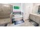Bathroom showcasing a glass door shower, soaking tub, and double vanity sink at 5229 Tye, Fairburn, GA 30213