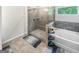Bathroom with glass shower, soaking tub, and window view at 5229 Tye, Fairburn, GA 30213