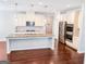 Spacious kitchen features granite countertops, stainless steel appliances, and a large center island at 5229 Tye, Fairburn, GA 30213