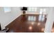 Living room with hardwood floors, fireplace, television and large windows at 5229 Tye, Fairburn, GA 30213