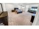 An expansive main bedroom boasts tray ceilings, neutral colors, and a sitting area for relaxation at 5229 Tye, Fairburn, GA 30213