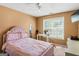 Comfortable bedroom featuring soft carpet, a full bed, and a bright window at 5832 Whitney Way, Rex, GA 30273