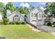 Inviting two-story home featuring a well-maintained lawn and a convenient two-car garage at 5832 Whitney Way, Rex, GA 30273
