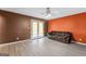 Spacious living room featuring modern floors, neutral walls, and access to the backyard at 5832 Whitney Way, Rex, GA 30273