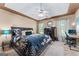 Inviting main bedroom with a ceiling fan, carpeted floors, and comfortable bedding at 5832 Whitney Way, Rex, GA 30273