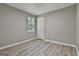 Cozy bedroom with neutral tones, natural light, and vinyl flooring at 288 Winthrop Dr, Sharpsburg, GA 30277