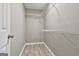 Walk-in closet with multiple shelves at 288 Winthrop Dr, Sharpsburg, GA 30277