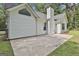Exterior of the house, showcasing the modern design and concrete patio perfect for outdoor enjoyment at 288 Winthrop Dr, Sharpsburg, GA 30277