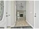 Inviting foyer featuring wood-look floors and a fireplace, with views into the living room at 288 Winthrop Dr, Sharpsburg, GA 30277