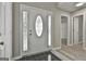 Inviting foyer features wood-look floors and a decorative front door, with neutral wall colors and ample lighting at 288 Winthrop Dr, Sharpsburg, GA 30277