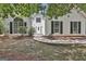 Inviting home exterior featuring a decorative glass front door, complemented by an arch window and dark shutters at 288 Winthrop Dr, Sharpsburg, GA 30277