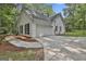 Attached two-car garage featuring a wide driveway, situated on a landscaped lot with a partial fence at 288 Winthrop Dr, Sharpsburg, GA 30277