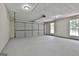 Spacious two car garage with white walls and epoxy floor at 288 Winthrop Dr, Sharpsburg, GA 30277
