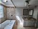 Spa bathroom features a soaking tub, double vanity and great light at 3140 Kipling Dr, Powder Springs, GA 30127