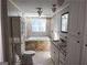 Relaxing bathroom featuring a soaking tub, modern fixtures, and plenty of storage at 3140 Kipling Dr, Powder Springs, GA 30127
