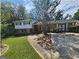 Charming two-story home with a lush front yard, mature trees and a welcoming driveway at 3140 Kipling Dr, Powder Springs, GA 30127