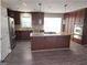 Modern kitchen features stainless steel appliances, spacious island, and ample cabinet space at 3140 Kipling Dr, Powder Springs, GA 30127