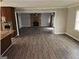 Spacious living room with a brick fireplace and modern flooring is perfect for relaxation at 3140 Kipling Dr, Powder Springs, GA 30127